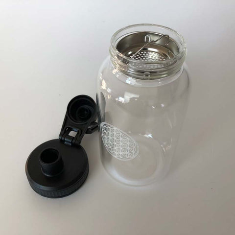 Glasflasche mit Blume des Lebens